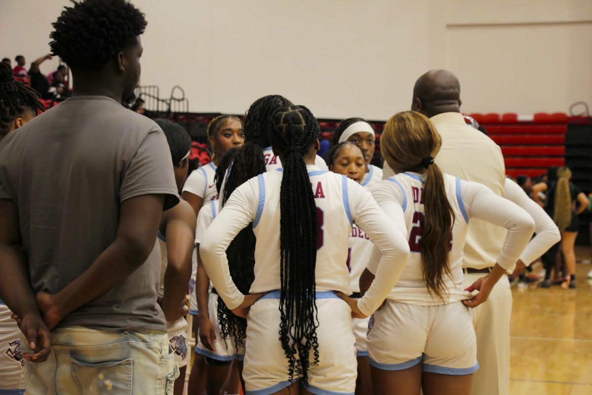 Coach Payne talking to the women's basketball team
